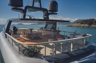 Benetti OASIS 40M sky deck from port quarter looking diagonally forward, showing seating, dining and bar area