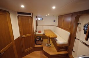 Fleming 85 crew mess and dinette with private crew access from the transom