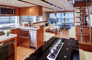 The galley and main saloon on board a Johnson 70 superyacht