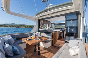 Marex 440 exterior cockpit on bright day, looking towards interior, boat is very open and inviting