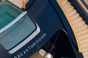 Aerial view of Superyacht Breakthrough aft deck with staircase and nameplate 
