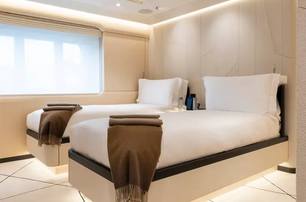 Amels superyacht Synthesis guest cabin with twin beds 