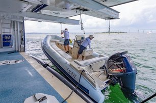 yacht crew tender launching deck crew