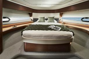 Princess F65 motor yacht forward guest cabin with windows 