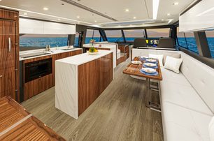 Riviera 645 SUV Series II motor yacht saloon/galley with dining area 
