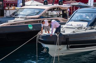 two men inspecting yacht