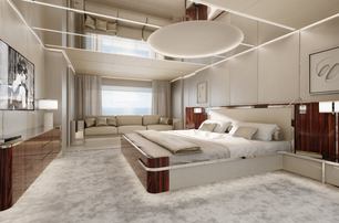 Overview of the master cabin with a central berth and plush seating in the background onboard motor yacht ASANI