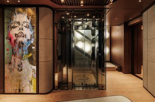 Sanlorenzo 74Steel superyacht Silver Fox glass elevator with abstract artwork  
