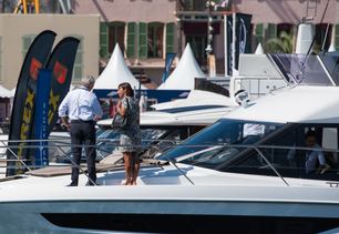 charter manager meeting with charter broker on deck at boat show