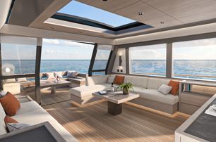 Pardo GT75 showing main salon from starboard side looking into the salon and out toward the aft deck through open sliding doors, neutral palette with pops of orange to brighten