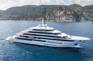 Freire Yachts RENAISSANCE making way, aerial shot over starboard side, mountain landscape in background, reasonably bright day