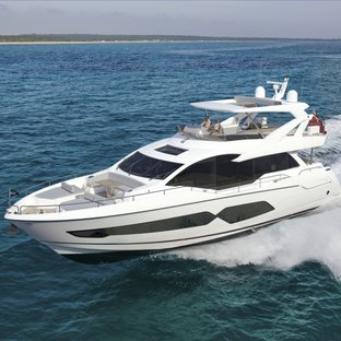 76 Yacht mid aerial view over port bow and side profile, yacht creating wash so moving at speed, clear day, calm waters