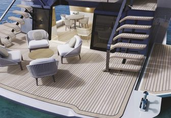 Mangusta Oceano 39 aerial shot over aft deck with side wings extended, freestanding furniture and twin staircases leading up