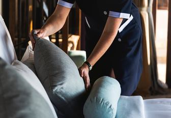 Yacht interior crew wearing uniform for specific duties