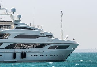 Benetti superyacht SEANNA shown starboard side profile from amidships looking towards the bow, on anchor in moderate sea on bright day