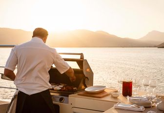 yacht chef preparing deck barbecue BBQ