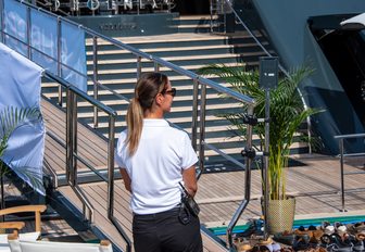 yacht crew wearing sunglasses on dock