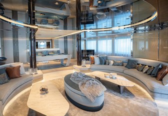 Interior of superyacht TATIANA with sofas and tables visible