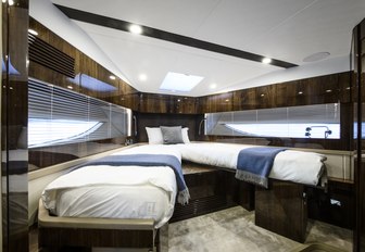 two berths with white line and high-gloss wooden wall panels make up the twin cabin on board the Targa 45 model