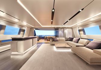 Baglietto yacht range DOM133 interior salon shot looking forward, illuminated lighting features by floor and cabinetry