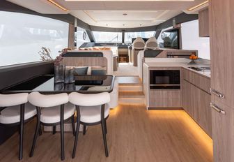 Gulf Craft Majesty 60 interior shot looking over dining area towards helm area