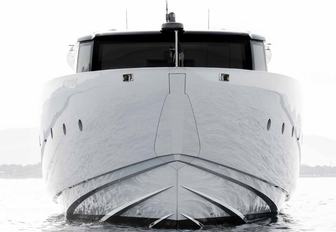 Sanlorenzo SP110 motor yacht stationary in calm water, bow on, from water level