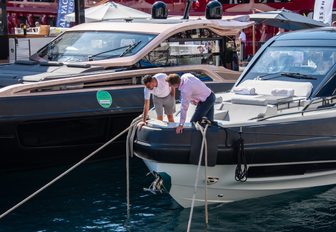 two men inspecting yacht