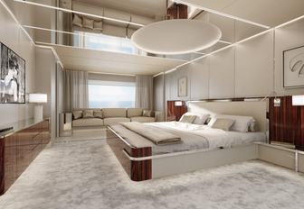 Overview of the master cabin with a central berth and plush seating in the background onboard motor yacht ASANI