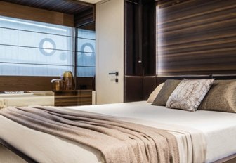 A guest cabin on board a Ferretti 670 motor yacht.