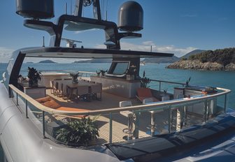 Benetti OASIS 40M sky deck from port quarter looking diagonally forward, showing seating, dining and bar area