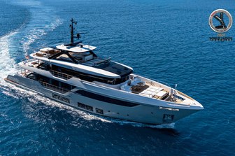 A Custom Line Navetta 38 at sea displaying its commanding exterior spaces