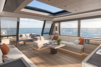 Pardo GT75 showing main salon from starboard side looking into the salon and out toward the aft deck through open sliding doors, neutral palette with pops of orange to brighten