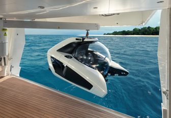 personal luxury submarine being launched off yacht