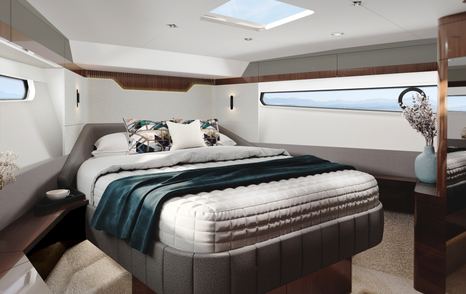 Rendering of cabin onboard Fairline Targa 40. Central berth with narrow windows on either side.