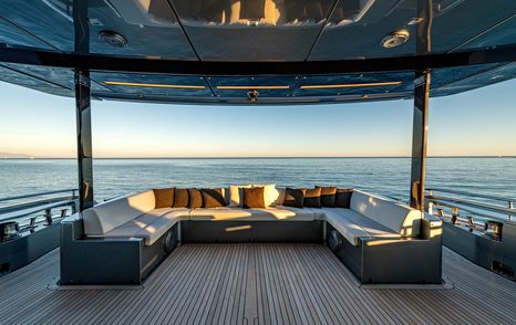 Superyacht Taku main aft deck with U-shaped seating