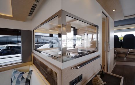 Beneteau Grand Trawler 63 galley serving hatch connecting the saloon and helm station