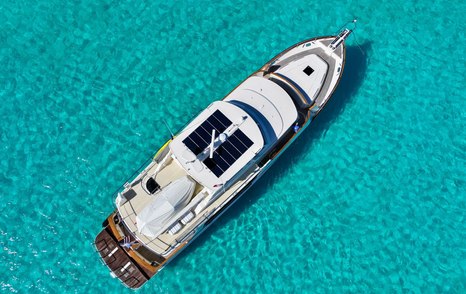 Overhead view of Fleming 85 at anchor showing flybridge and boat deck layout