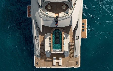 Aerial view of Superyacht Amor a Vida with infinity pool and surrounding sunpads 