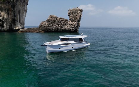 Greenline 42 motor yacht at anchor showing coupe profile and solar roof