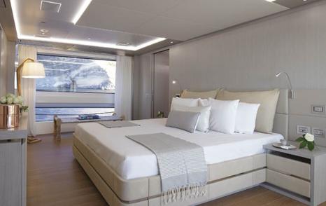 Overview of the master cabin onboard motor yacht LOUI, central berth and large window aft