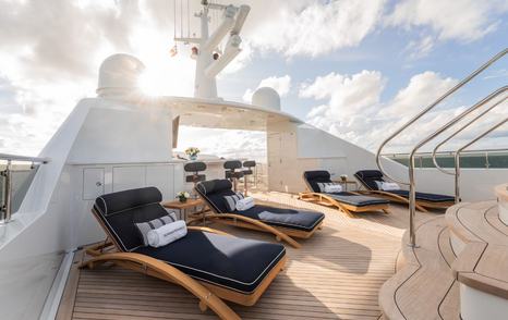Superyacht Summer Dance sundeck with blue sun loungers 