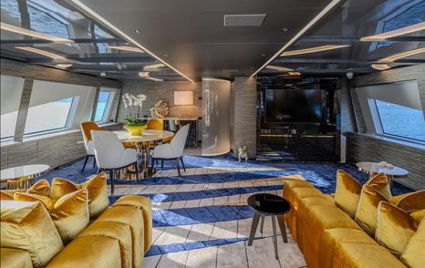 Superyacht Charisma interior seating area with circular table