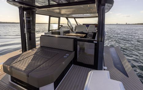Saxdor 400 GTC aft deck sunpad and side balconies view through to helm