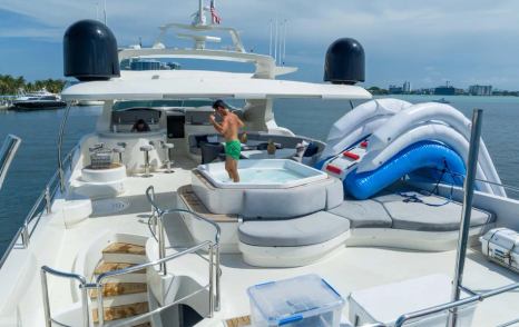 Superyacht Rylax aft jacuzzi with man in