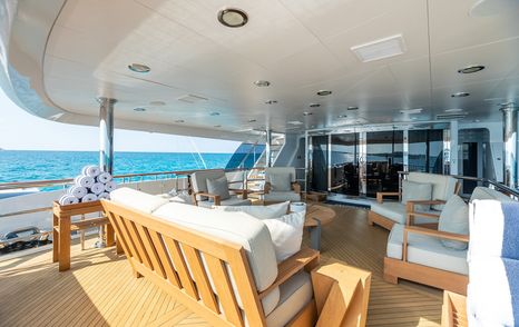 Superyacht Impromptu main aft deck with shaded white seating 