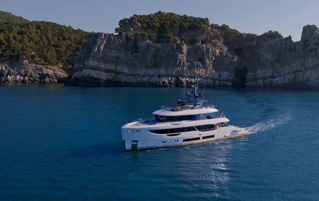 Benetti Oasis 34M cruising offshore, showing the yacht's tri-deck layout and exterior proportions.