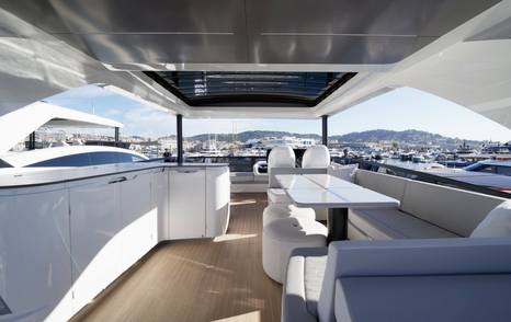 Pearl 73 flybridge bar, dining area and forward helm