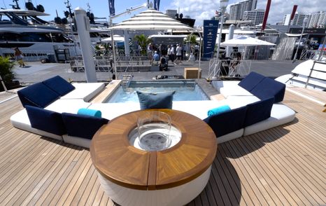 Benetti Oasis 34M Oasis Deck social space with circular lounge seating, pool and sea-level entertaining area.