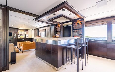 Superyacht Victory's main saloon wooden bar area