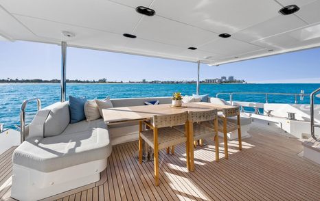 superyacht aft deck with dining area